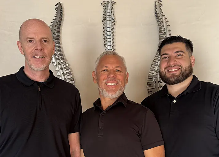 Guillermo Hernandez, Chris Manning, And Fernando Herrera smiling in black shirts
